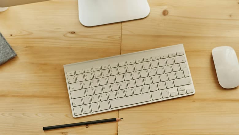 Keyboard and mouse on desk.